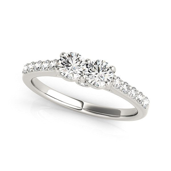 14k white gold two-stone diamond ring with pavé side stones.