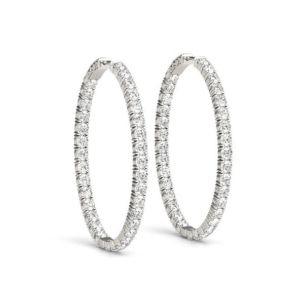 Two oval-shaped, two-sided diamond hoop earrings in 14k white gold.