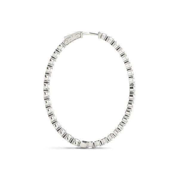White gold oval hoop earring with prong-set round diamonds on both sides.
