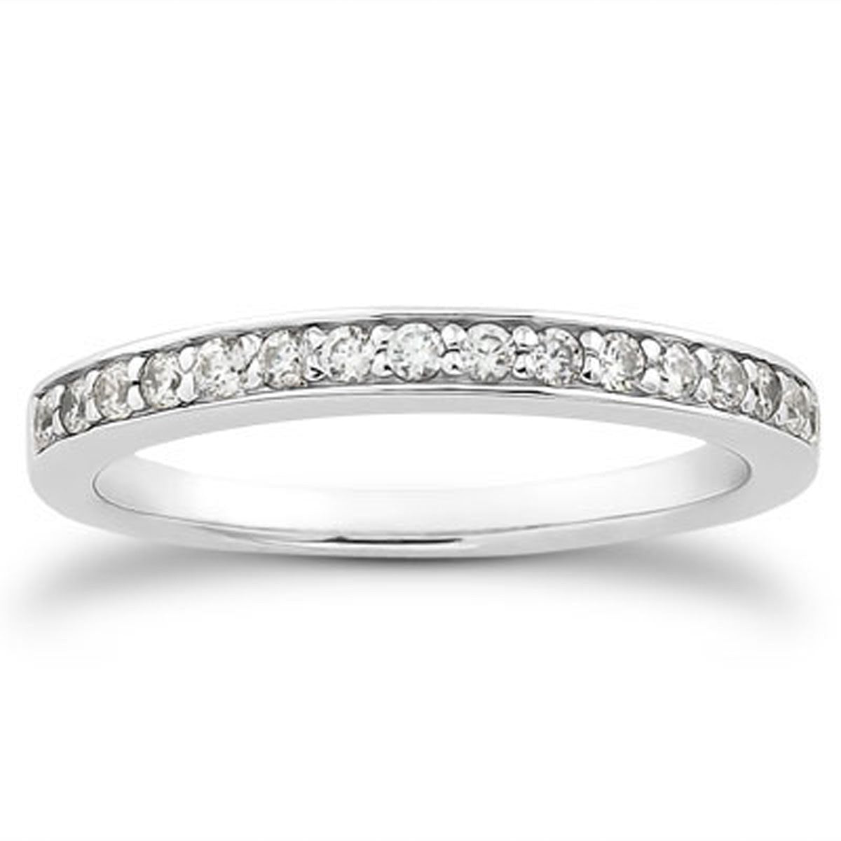 A 14k white gold wedding band with pave diamonds halfway around.