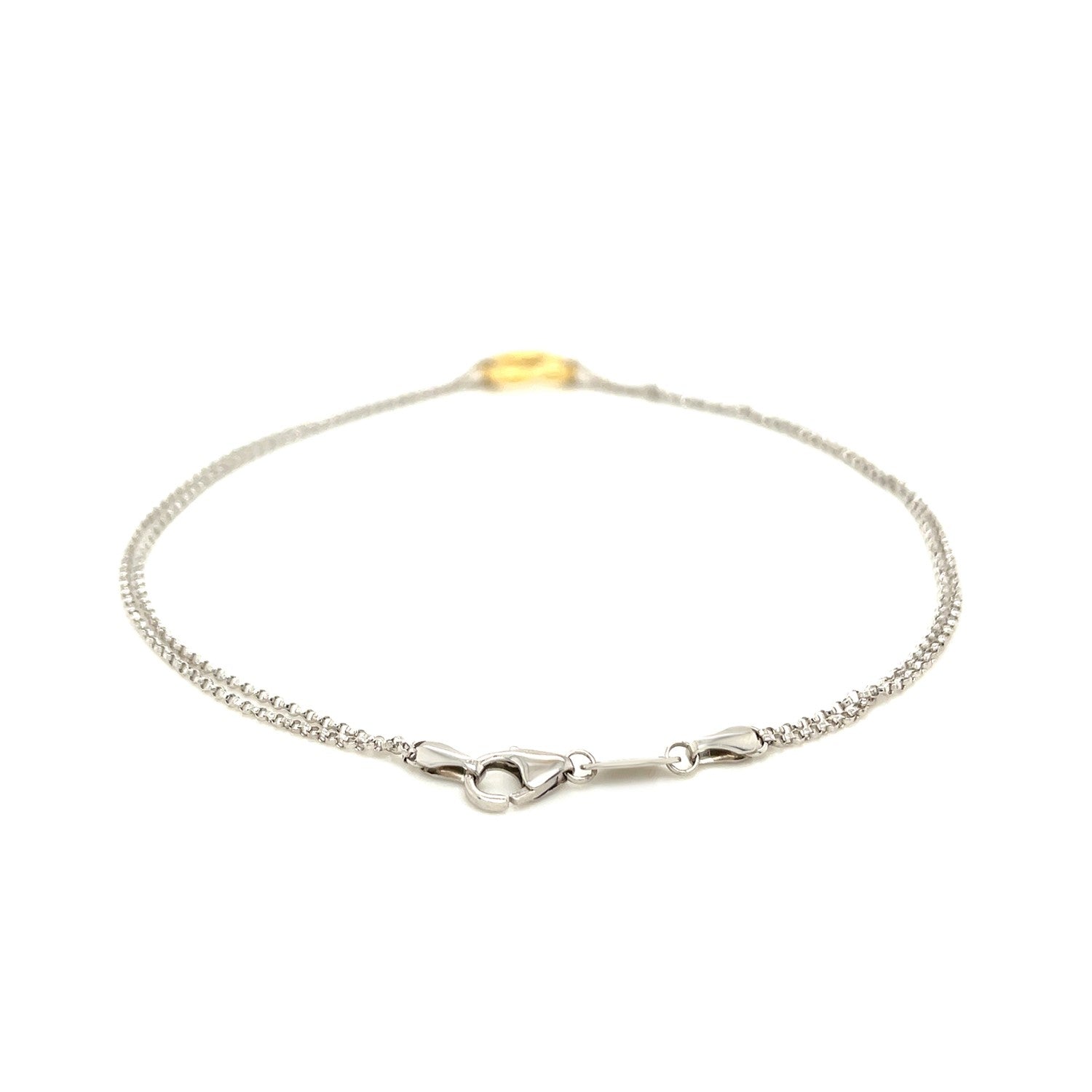 A sterling silver anklet with a single open heart station and a lobster clasp.