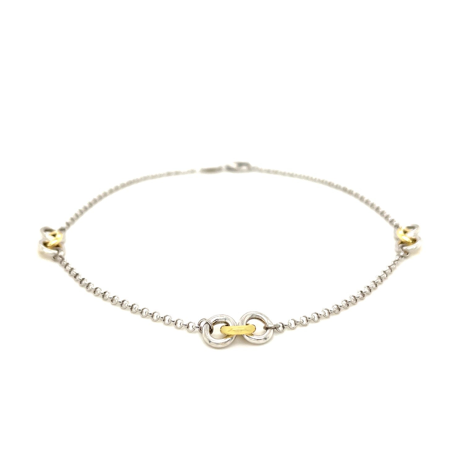 14k yellow gold and sterling silver triple ring stationed anklet on a white background.