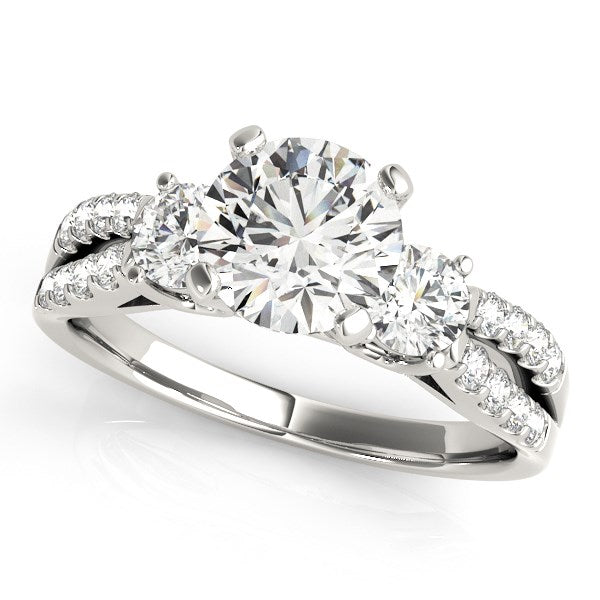 14k white gold split shank engagement ring with three round diamonds and pavé accents.