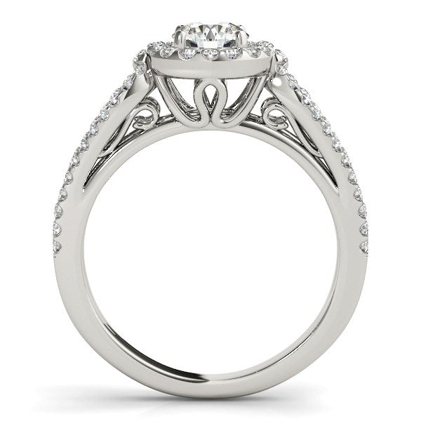 14k white gold diamond engagement ring with a round center stone and pave split shank.