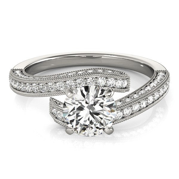 14k white gold round diamond bypass style engagement ring with pave set stones.