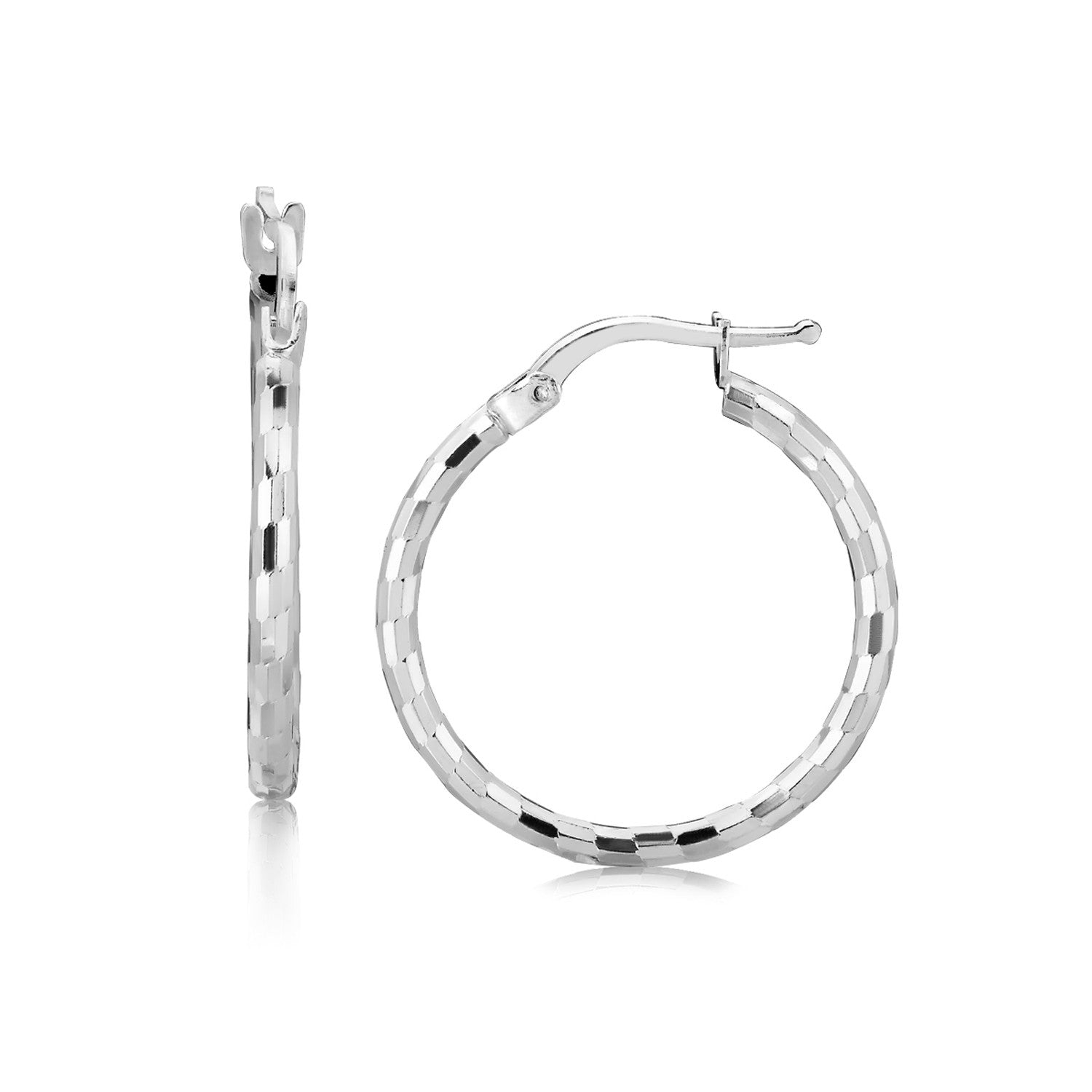 A pair of rhodium-plated sterling silver diamond-cut hoop earrings with snap locks.