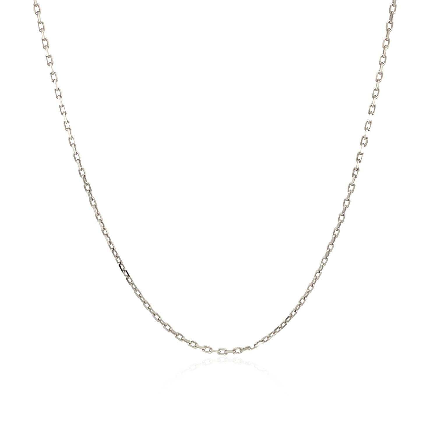 A sterling silver rhodium-plated cable chain is draped against a white background.