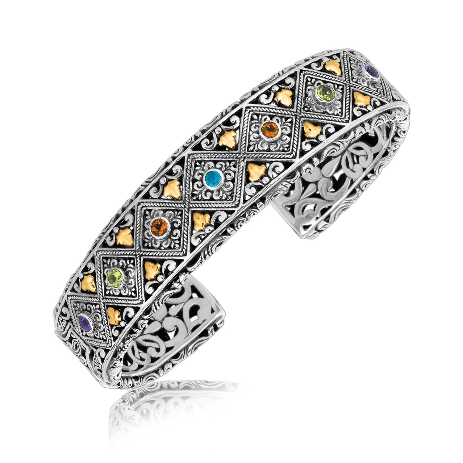 Sterling silver and 18K yellow gold open cuff with diamond patterns and multi-stone embellishments.