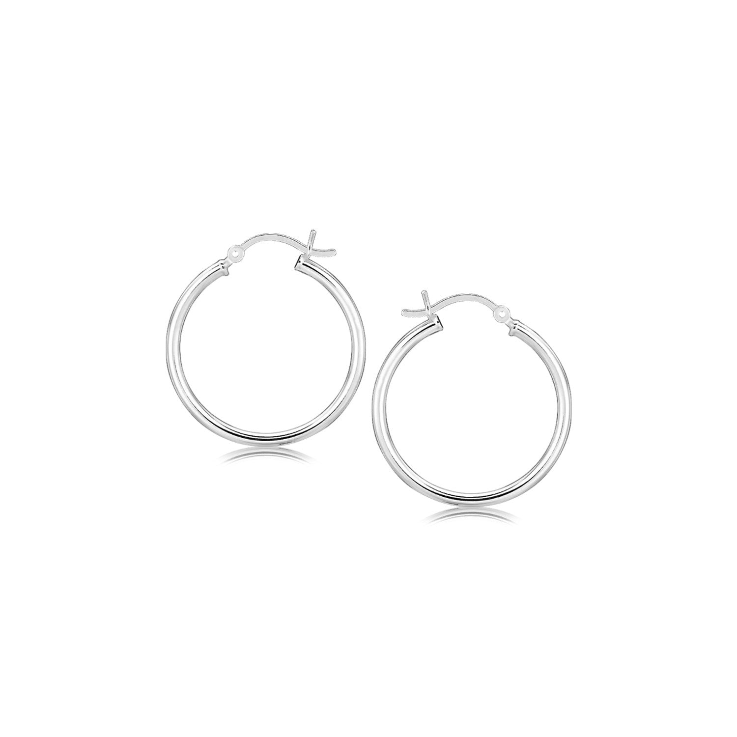 A pair of polished sterling silver rhodium-plated hoop earrings with snap locks.
