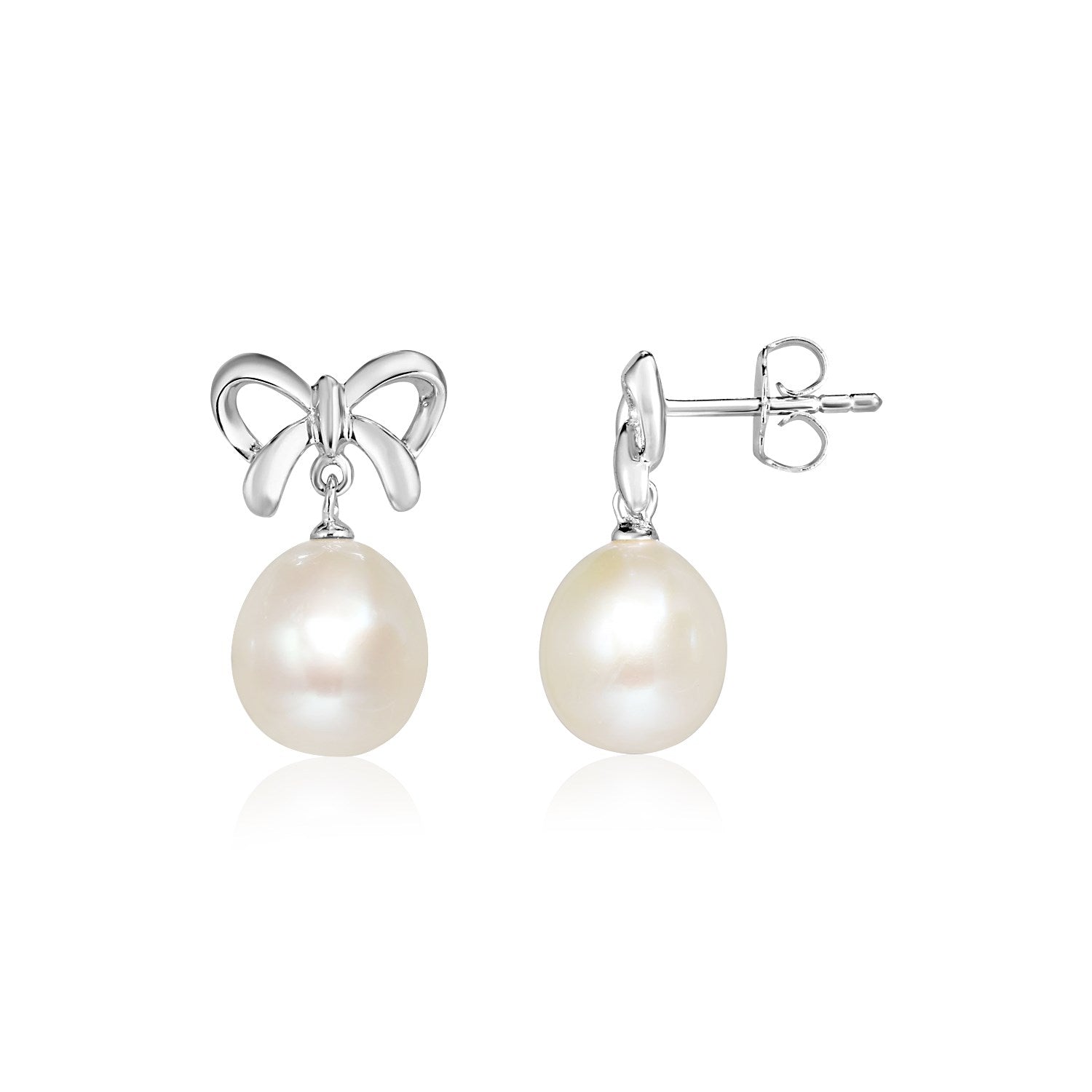 Sterling silver bow earrings with dangling freshwater pearls and pushback clasps.
