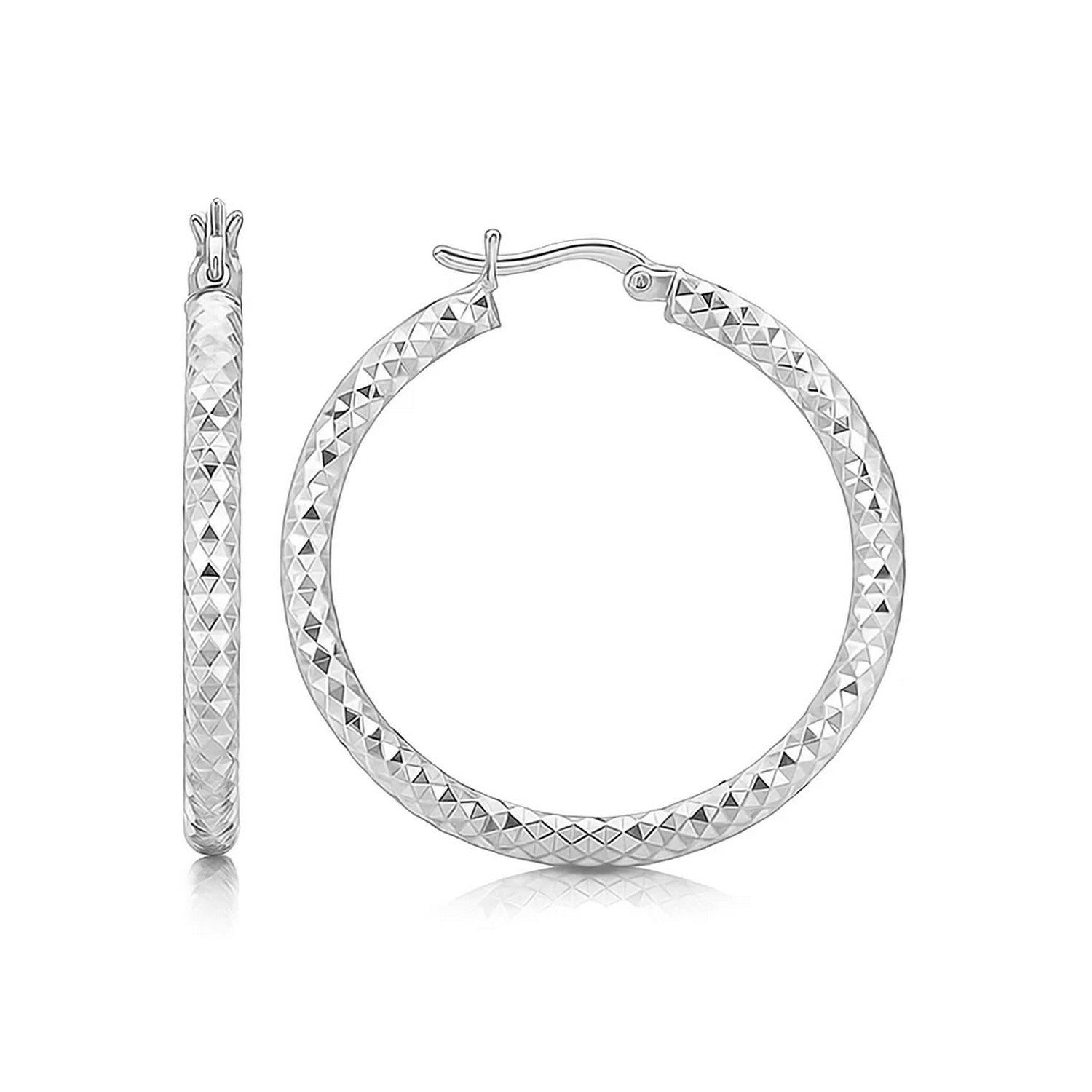 Sterling silver faceted hoop earrings with rhodium plating and snap locks.