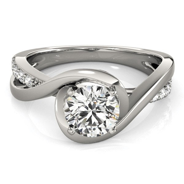 14k white gold bypass engagement ring with a round diamond and pavé accents.