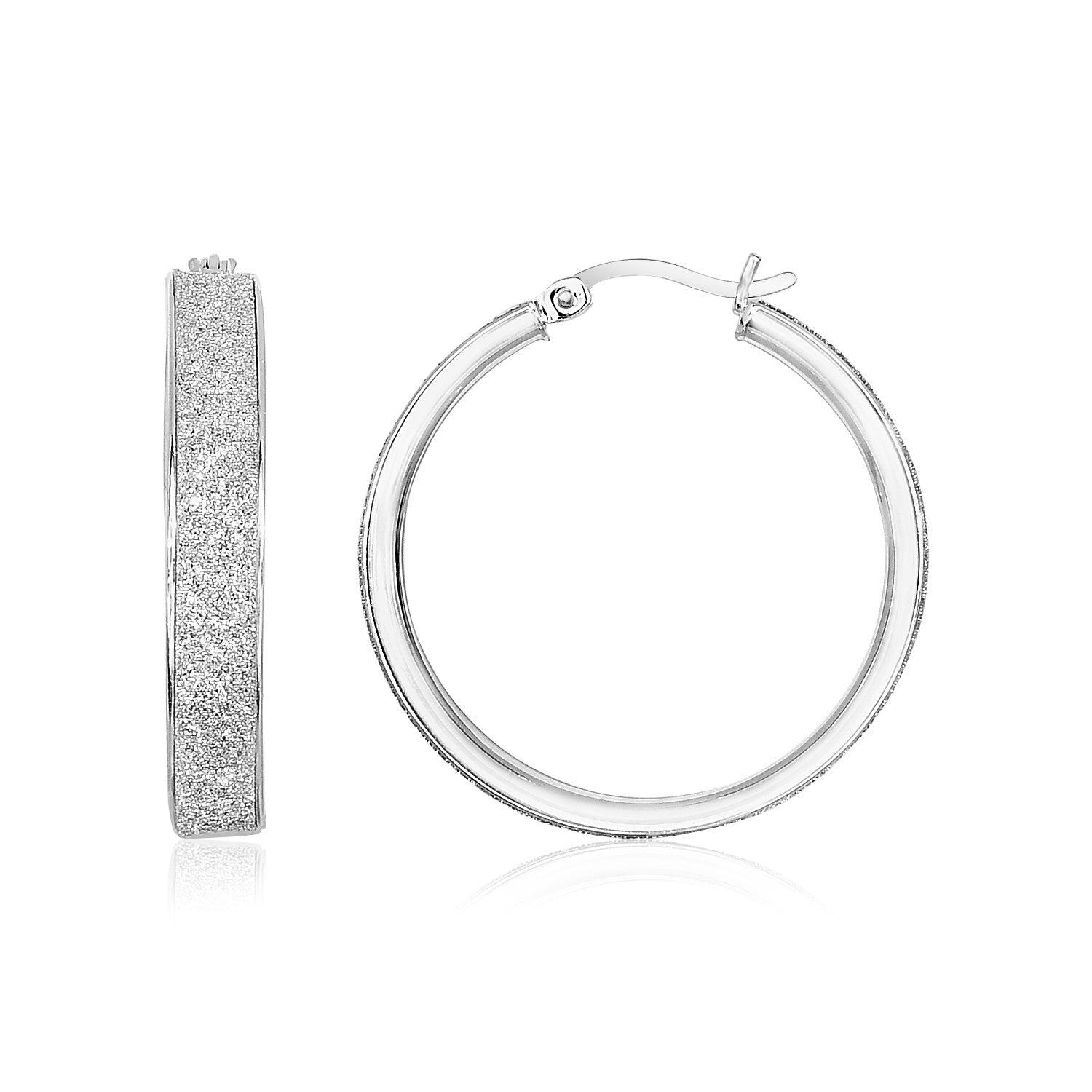 Sterling silver hoop earrings with a glitter texture and hinged clasps.