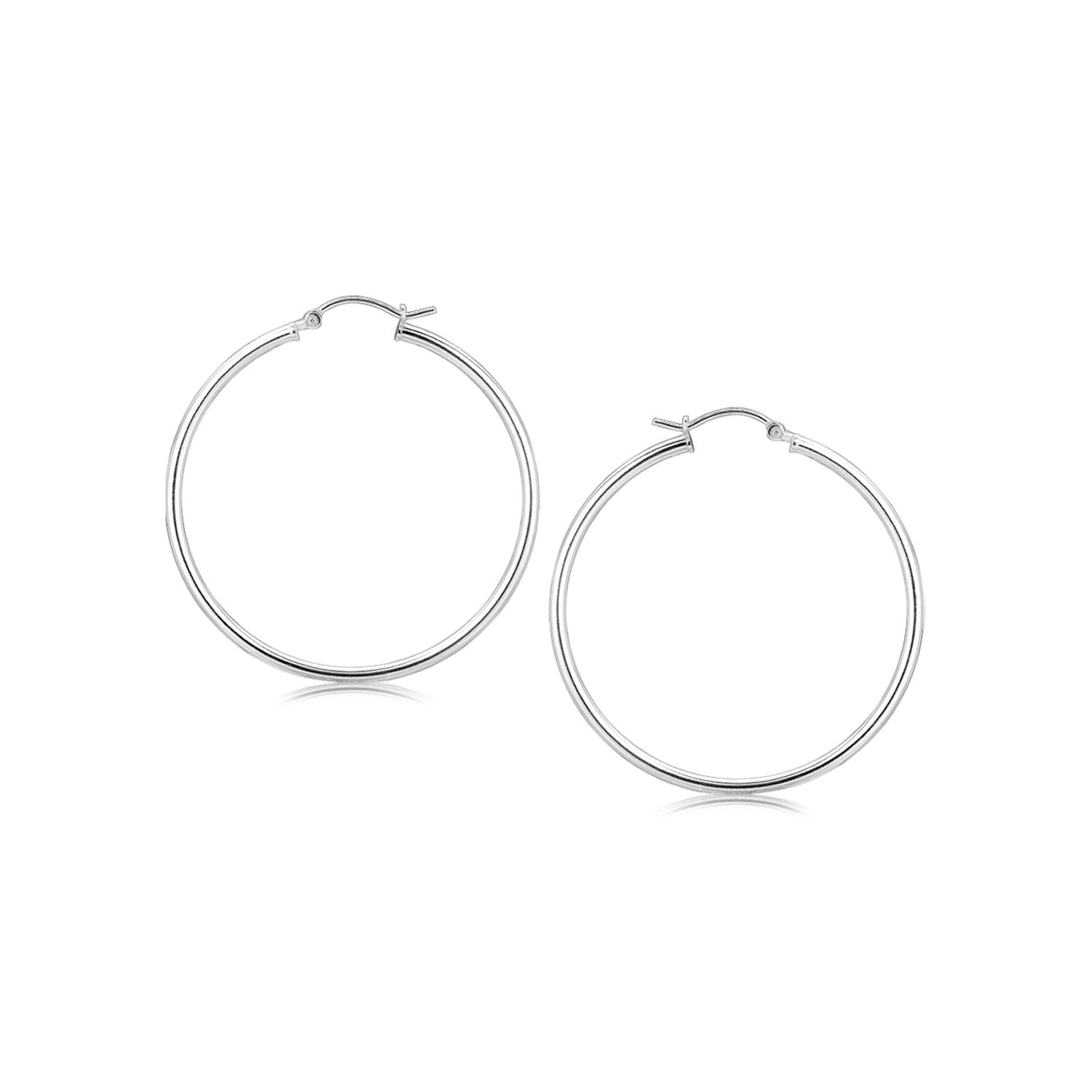 Sterling silver rhodium plated thin large polished hoop earrings with snap locks.