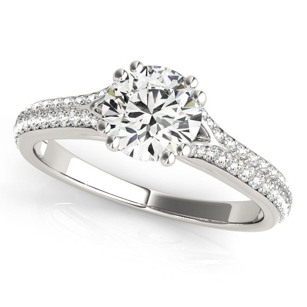 14k white gold engagement ring with a round diamond and multirow pavé band.