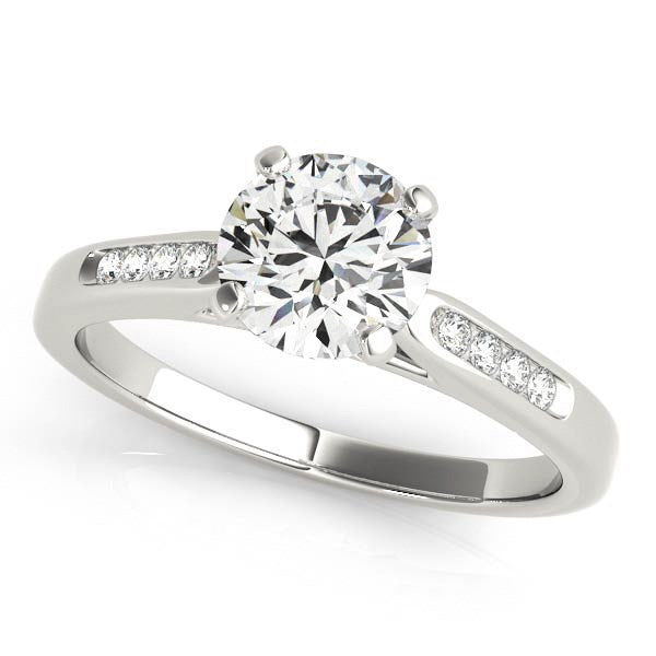 14k white gold engagement ring with a round diamond and channel-set side stones.