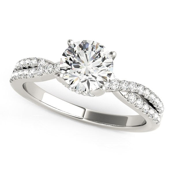 A 14k white gold engagement ring with a round diamond and pave split shank.