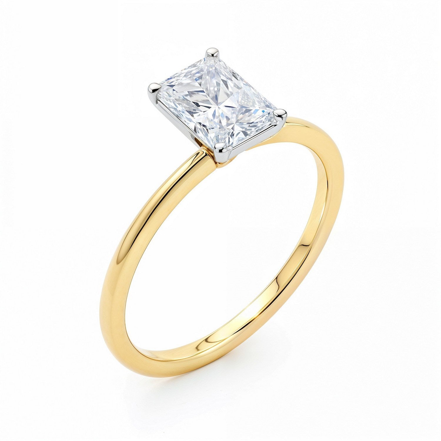 A radiant lab-grown diamond ring with a yellow gold band and white gold prongs.