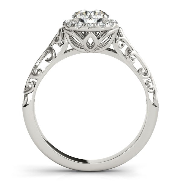 14k white gold halo antique style engagement ring with a round diamond and filigree band.