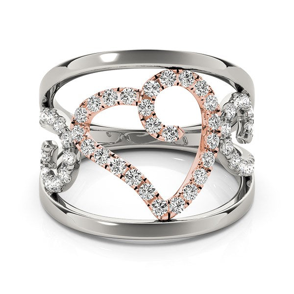 A white and rose gold ring with a diamond-encrusted heart and filigree design.