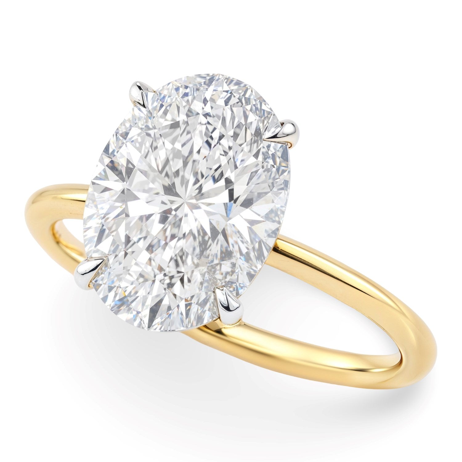 5 carat oval lab grown diamond solitaire ring with a yellow gold band.