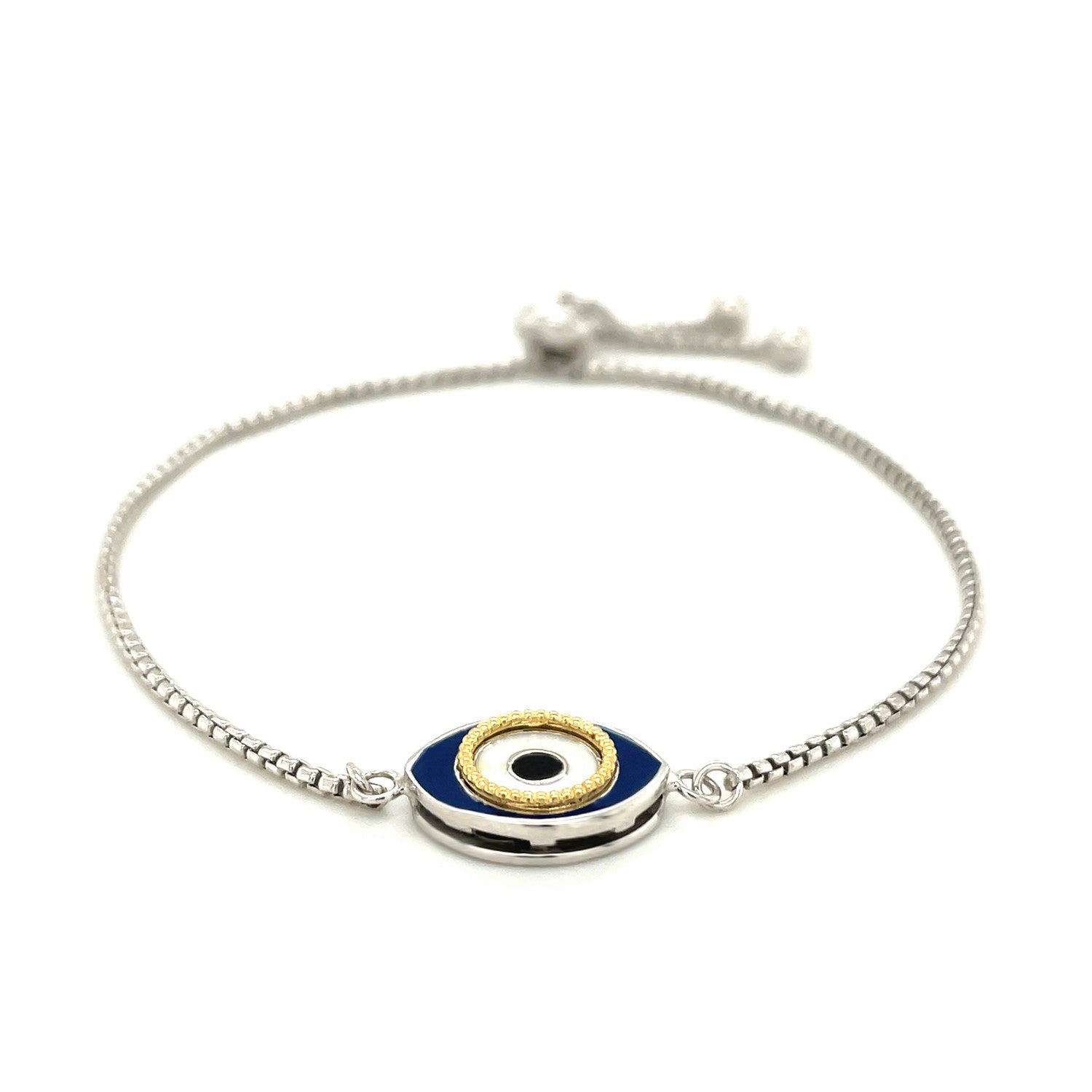 Sterling silver adjustable evil eye bracelet with blue and gold enamel.
