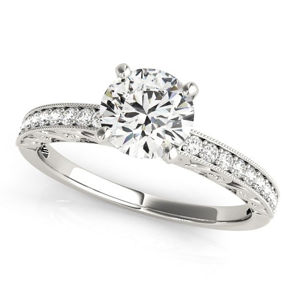 14k white gold antique style diamond engagement ring with a round center stone and side diamonds.