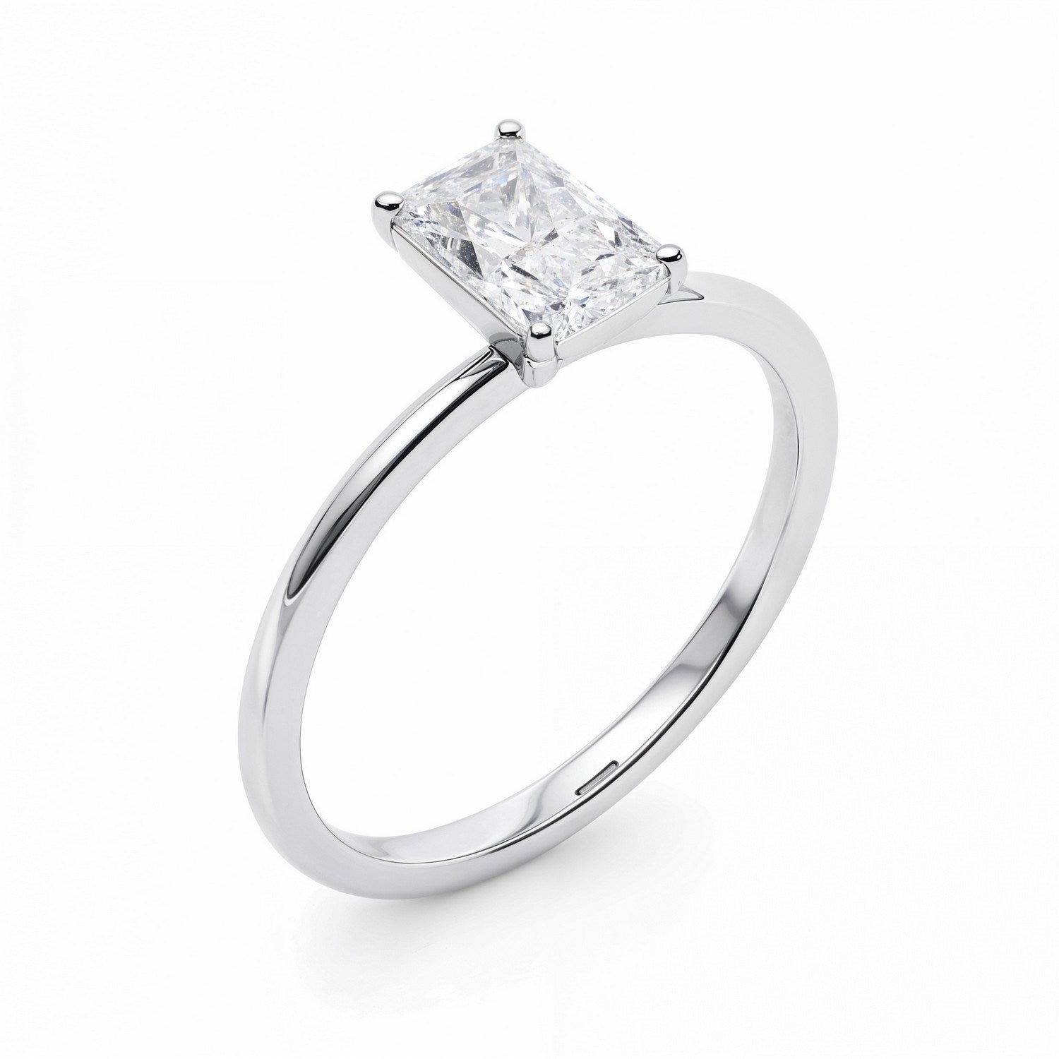 A radiant-cut lab-grown diamond solitaire ring in 14K white gold.