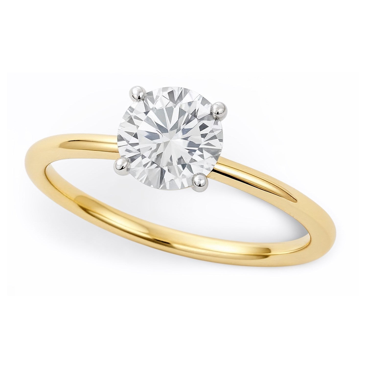 A round lab-grown diamond solitaire ring with a yellow gold band and white gold prongs.