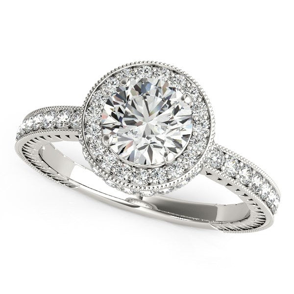14k white gold engagement ring with a round diamond center and pave diamond band.