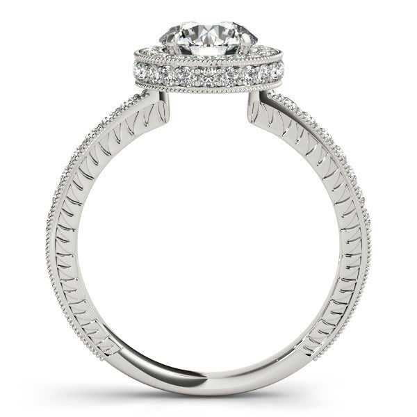 14k white gold engagement ring with a round diamond, pave, and milgrain detailing.