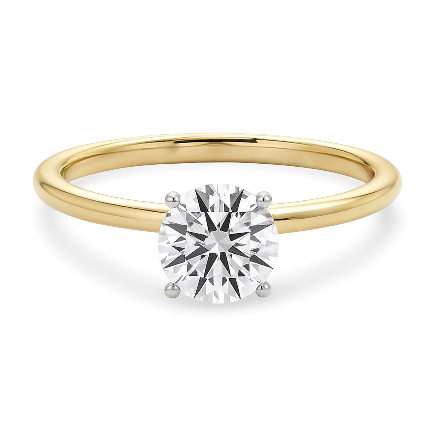 A 14K yellow gold solitaire ring with a round lab-grown diamond in a four-prong setting.