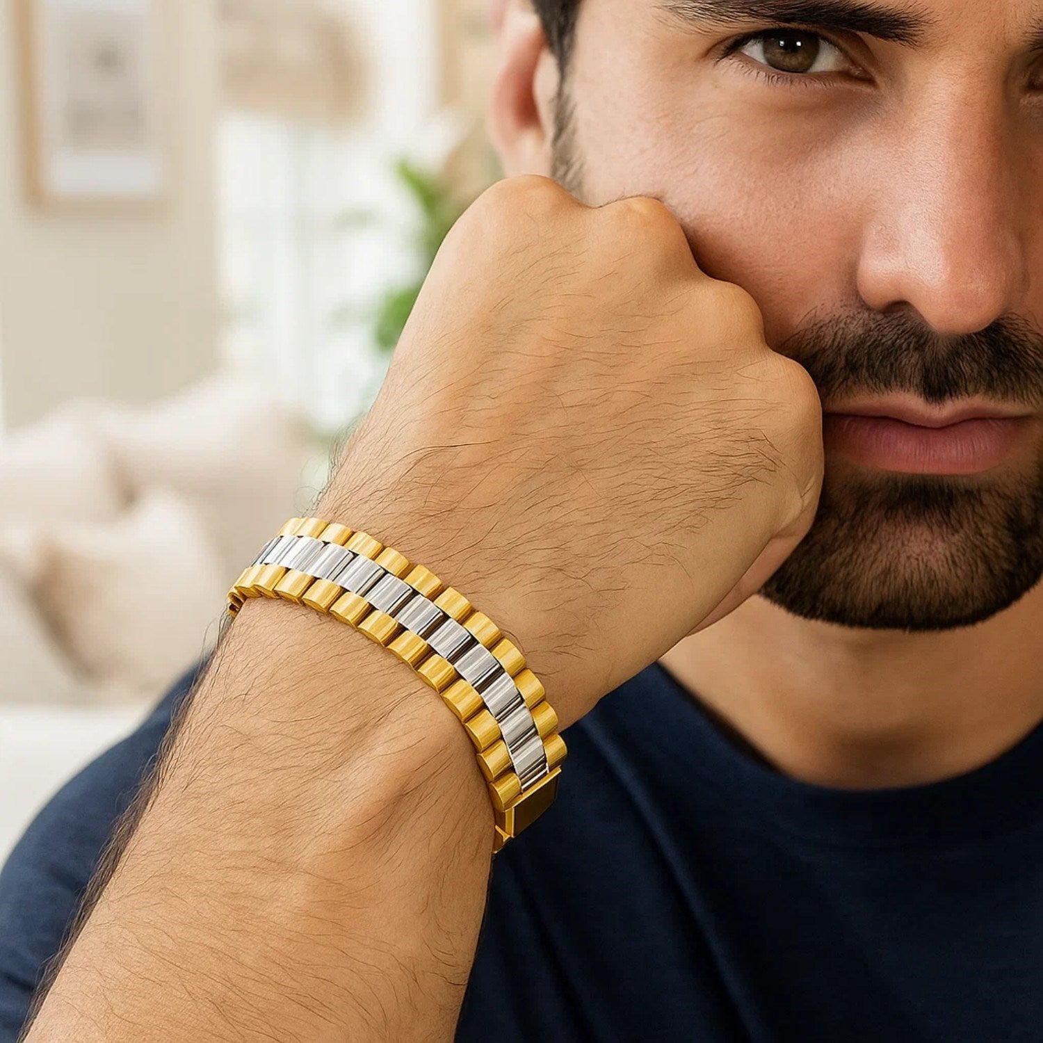 14k two-tone gold panther link bracelet on a man's wrist.
