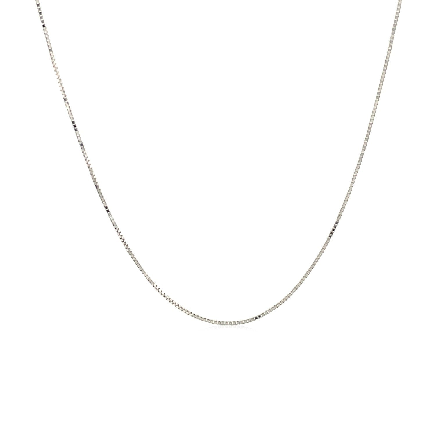 A delicate 10k white gold box chain, 0.45 mm wide, forms a gentle curve.
