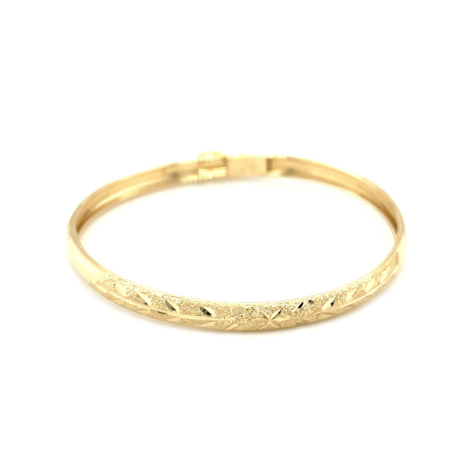 10k yellow gold children's dome bangle with a diamond-cut Florentine pattern.
