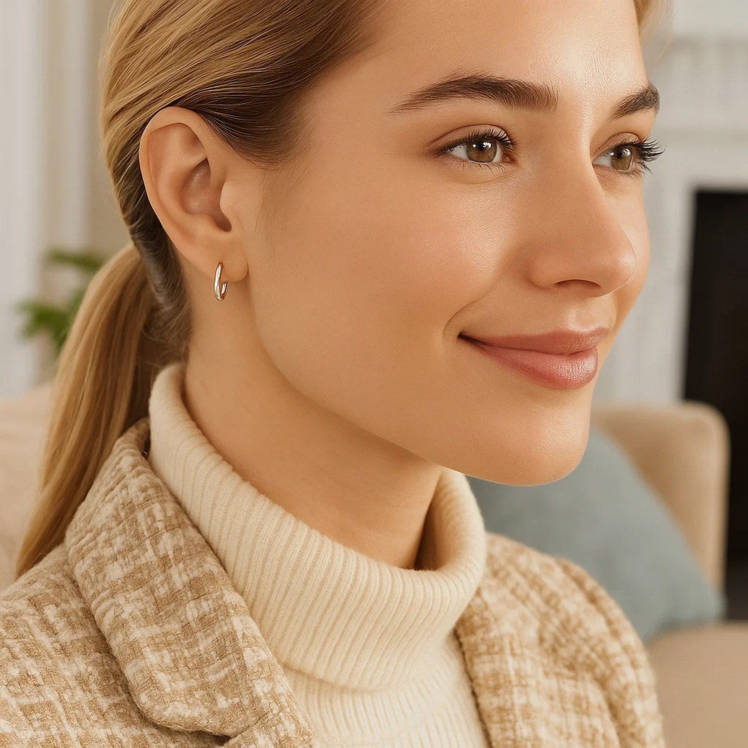 Sterling silver rhodium plated thin and small polished hoop earrings.