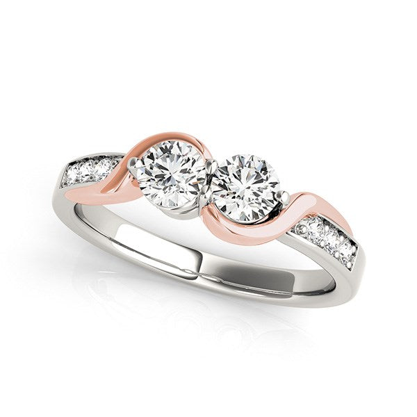 14k white and rose gold ring with two round diamonds and six side diamonds.
