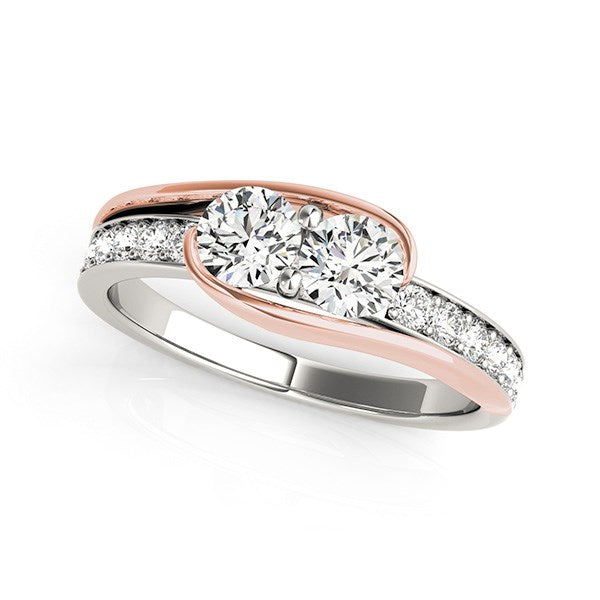 Two-stone diamond ring in 14k white and rose gold with side diamonds.