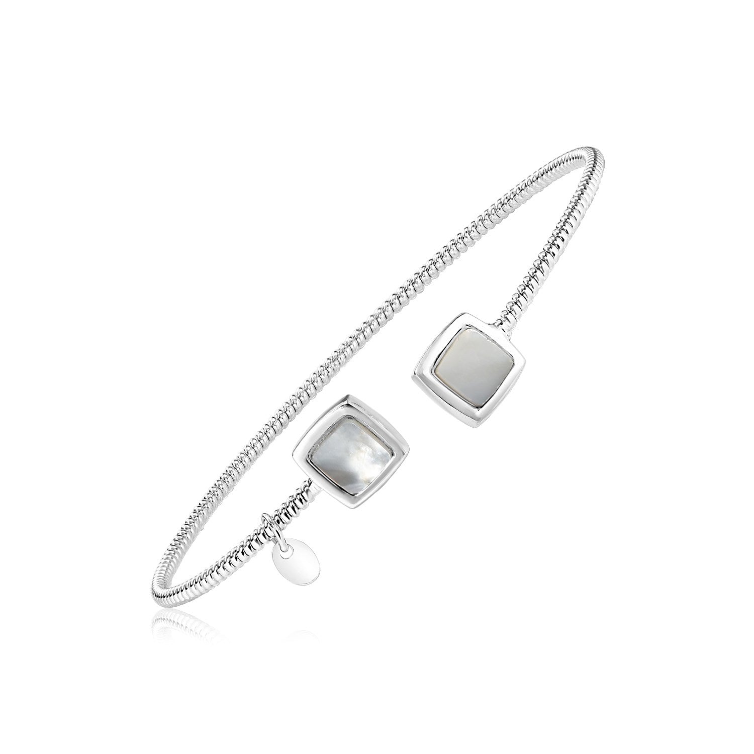 Sterling silver bangle with two mother of pearl squares and a small charm.