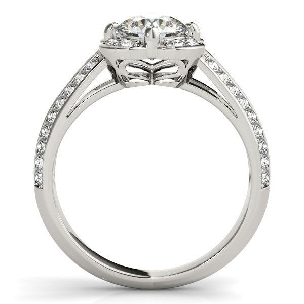 White gold engagement ring with a round diamond, halo, and diamond-set split shank.