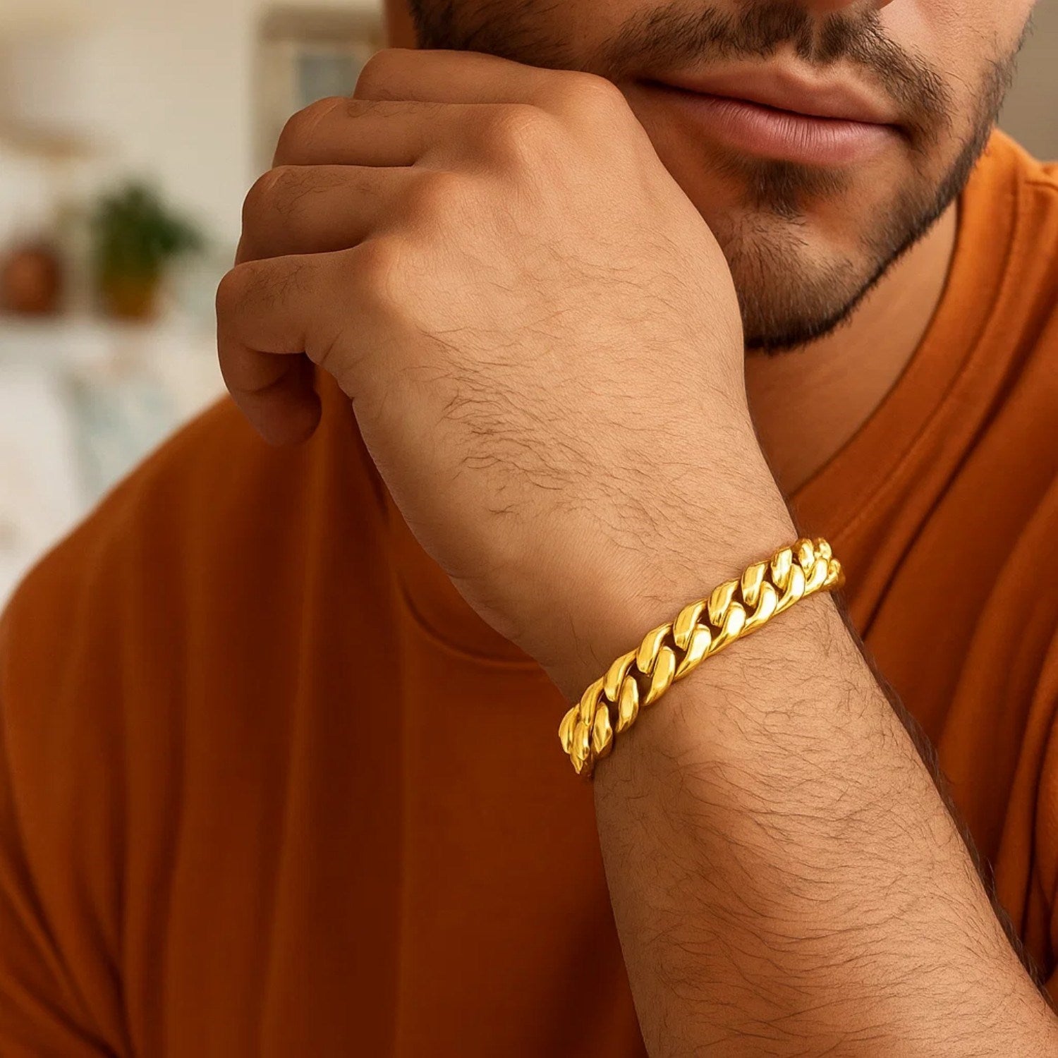 10k yellow gold semi-solid Miami Cuban bracelet on a man's wrist.