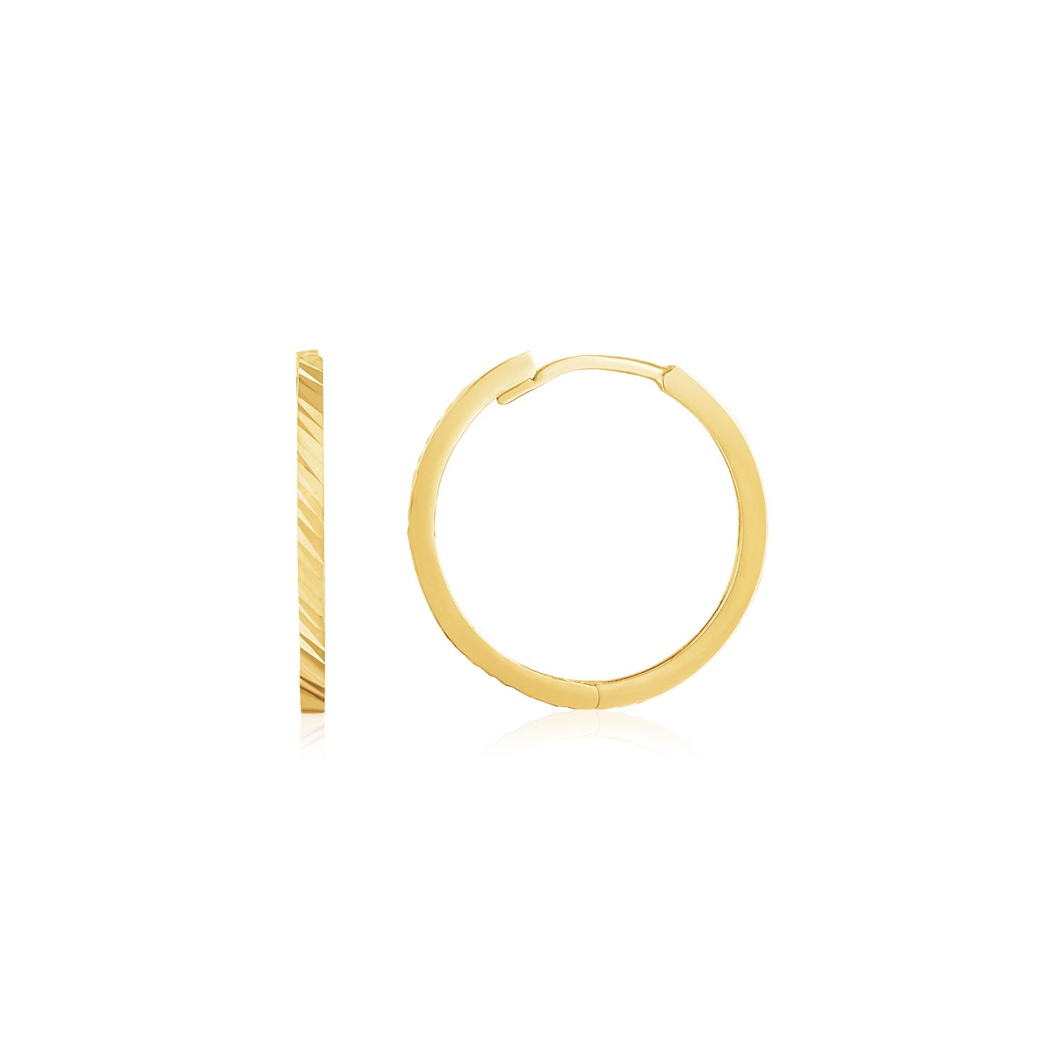Pair of 14k yellow gold diamond-cut textured huggie earrings with a snap closure.