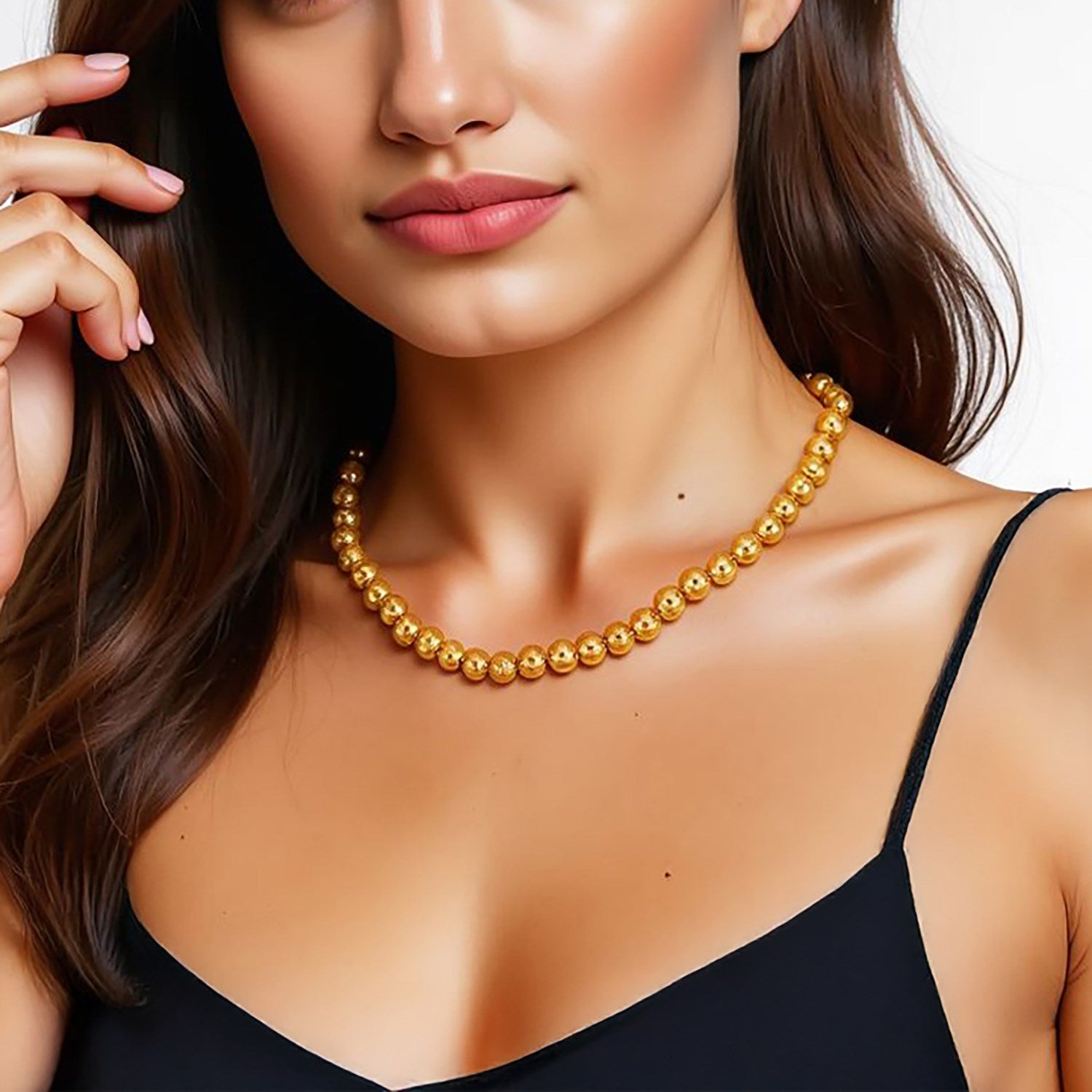 14k yellow gold bead chain necklace with a high polish finish on a woman.