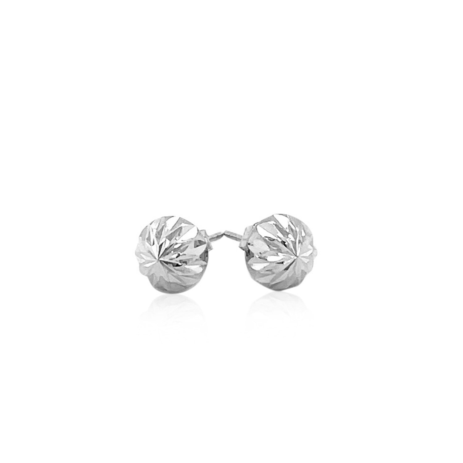 A pair of 14k white gold textured flat stud earrings with a sunburst design.