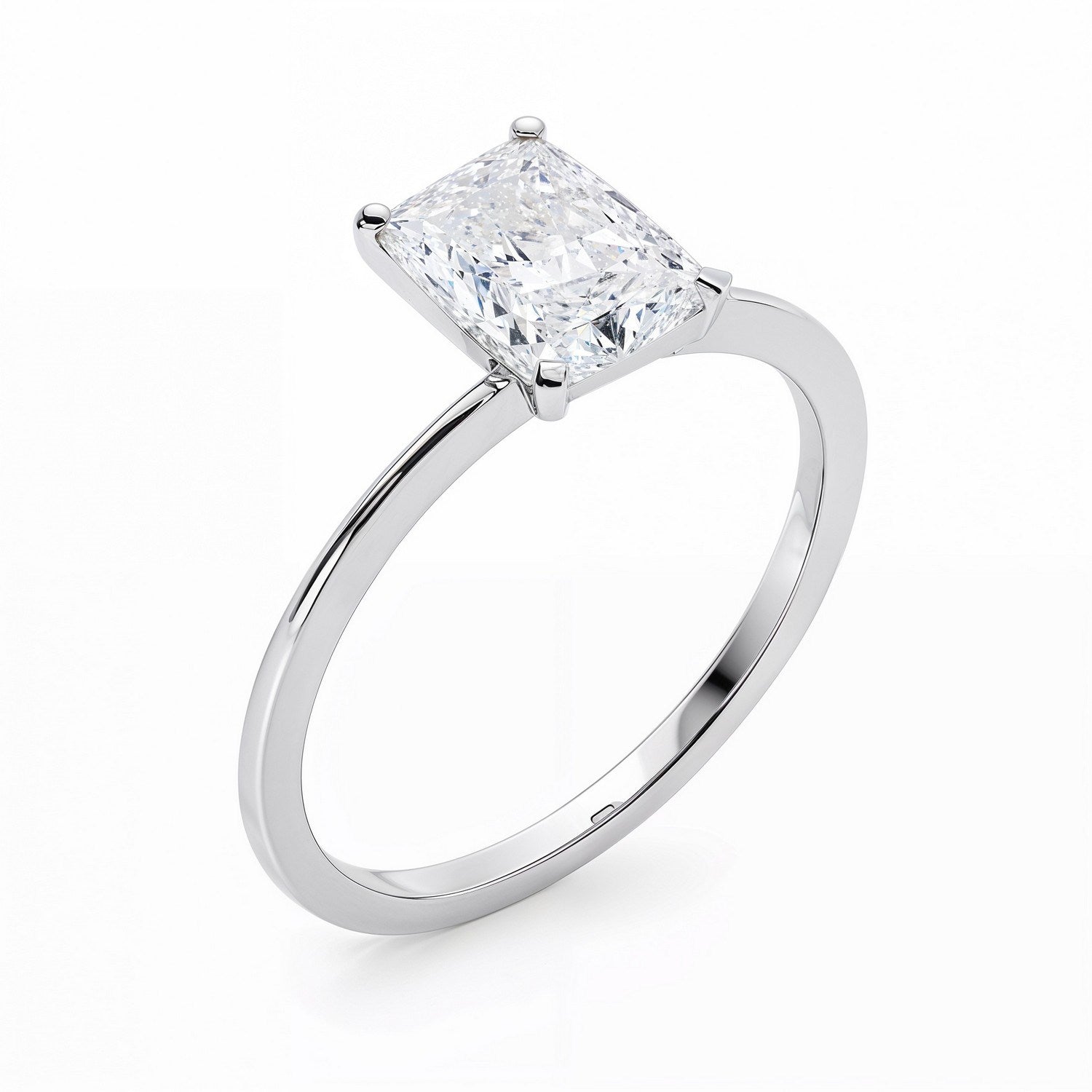 A radiant-cut lab-grown diamond solitaire ring in 14K white gold.
