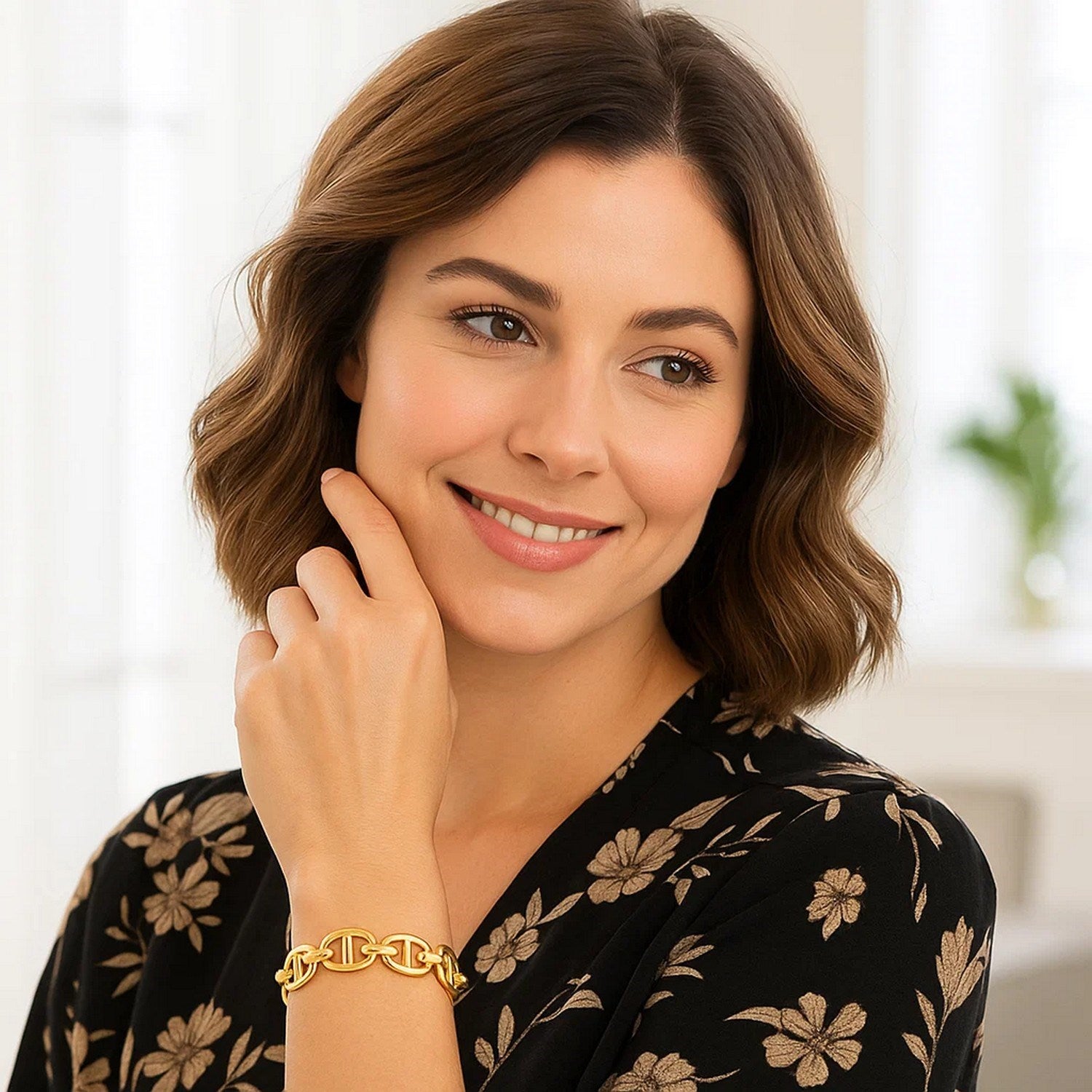 14k yellow gold high polish mariner link bracelet on a woman's wrist.