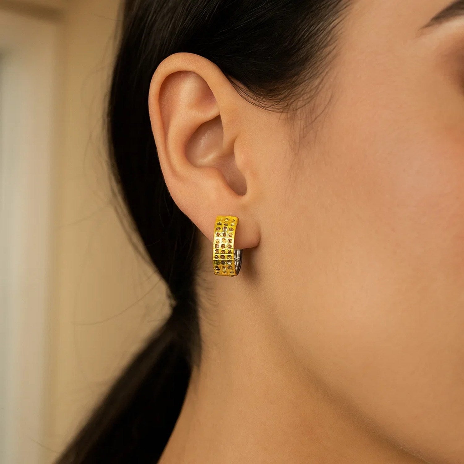14k two-tone gold snuggable earrings with a mesh style.