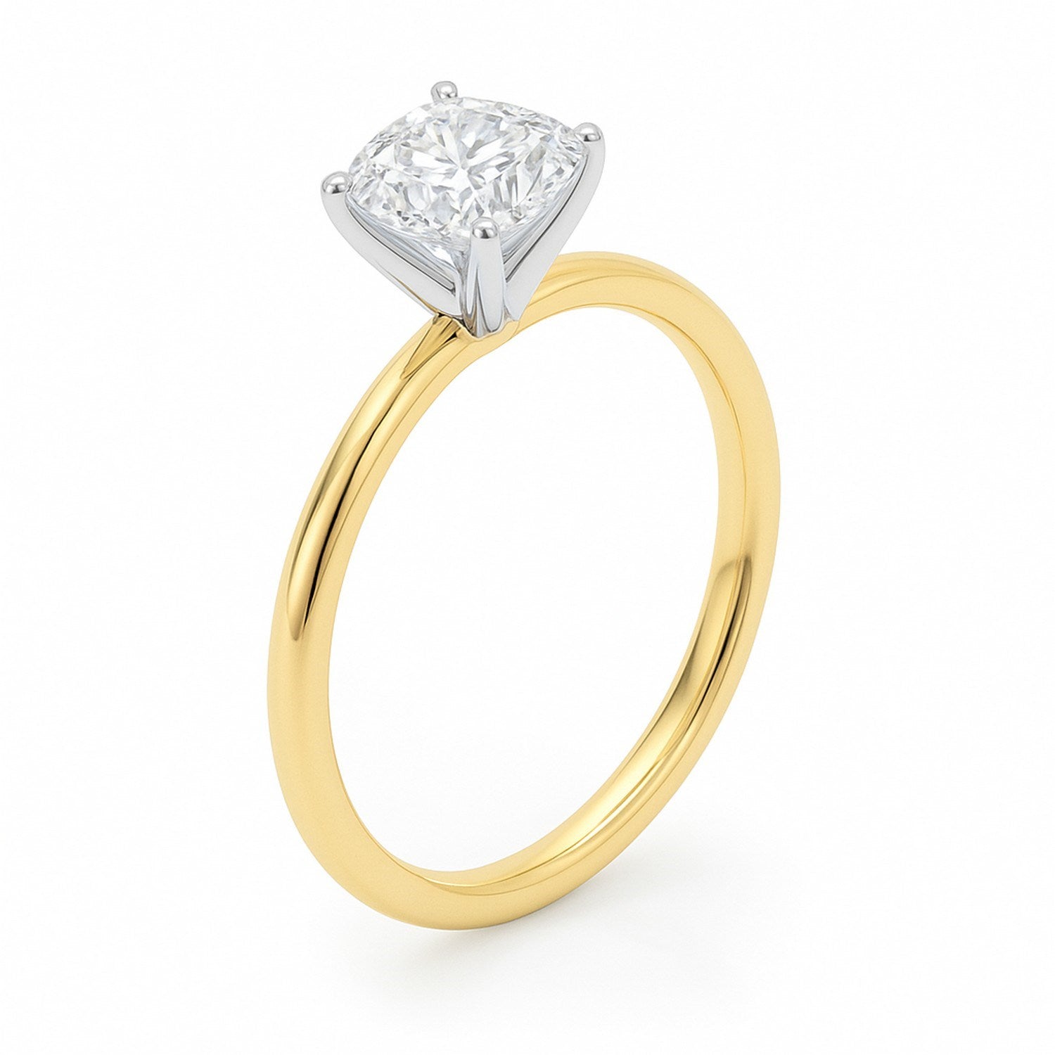A cushion-cut lab-grown diamond ring with a yellow gold band and white gold prongs.