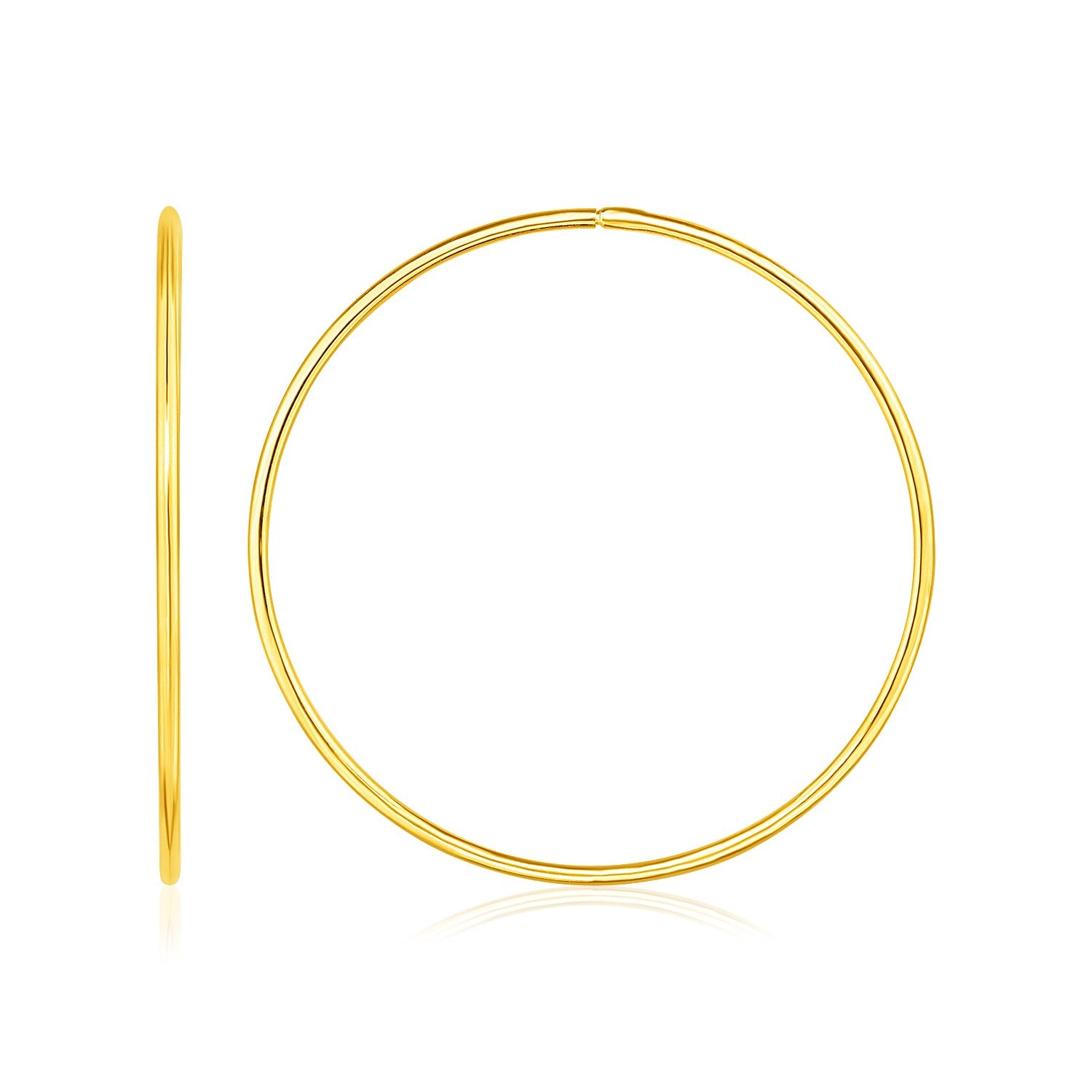 A pair of polished 14K yellow gold endless hoop earrings.