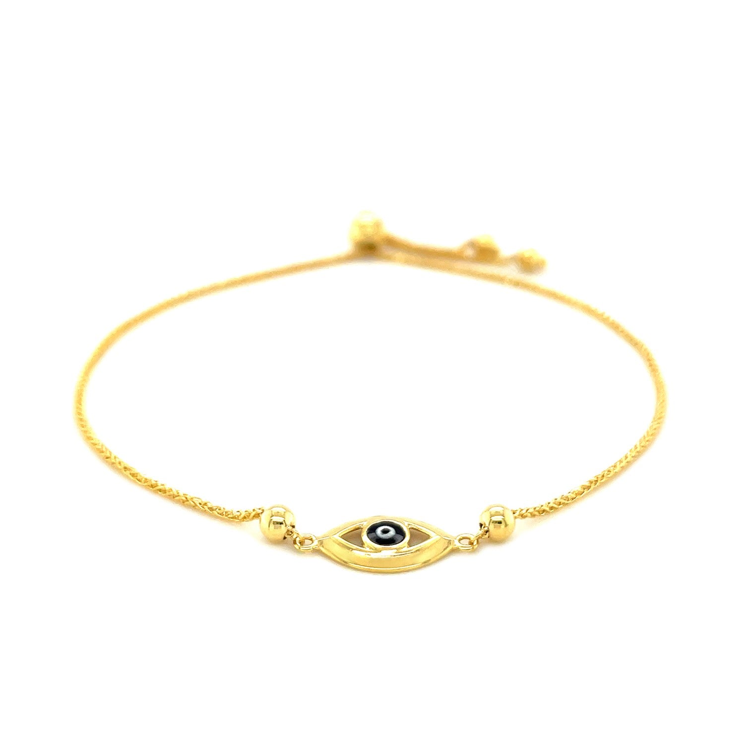14k yellow gold adjustable evil eye bracelet with a black and white pupil.